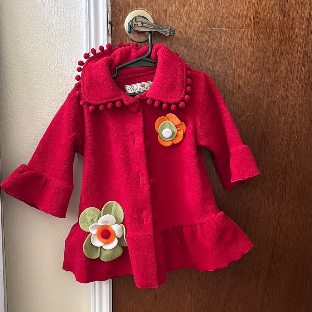 Vibrant Red Cape with Ruffled Hem and Playful Trim